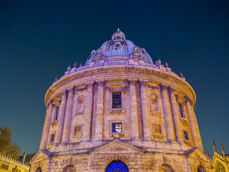 Photo of the Radcliffe Camera against a night sky